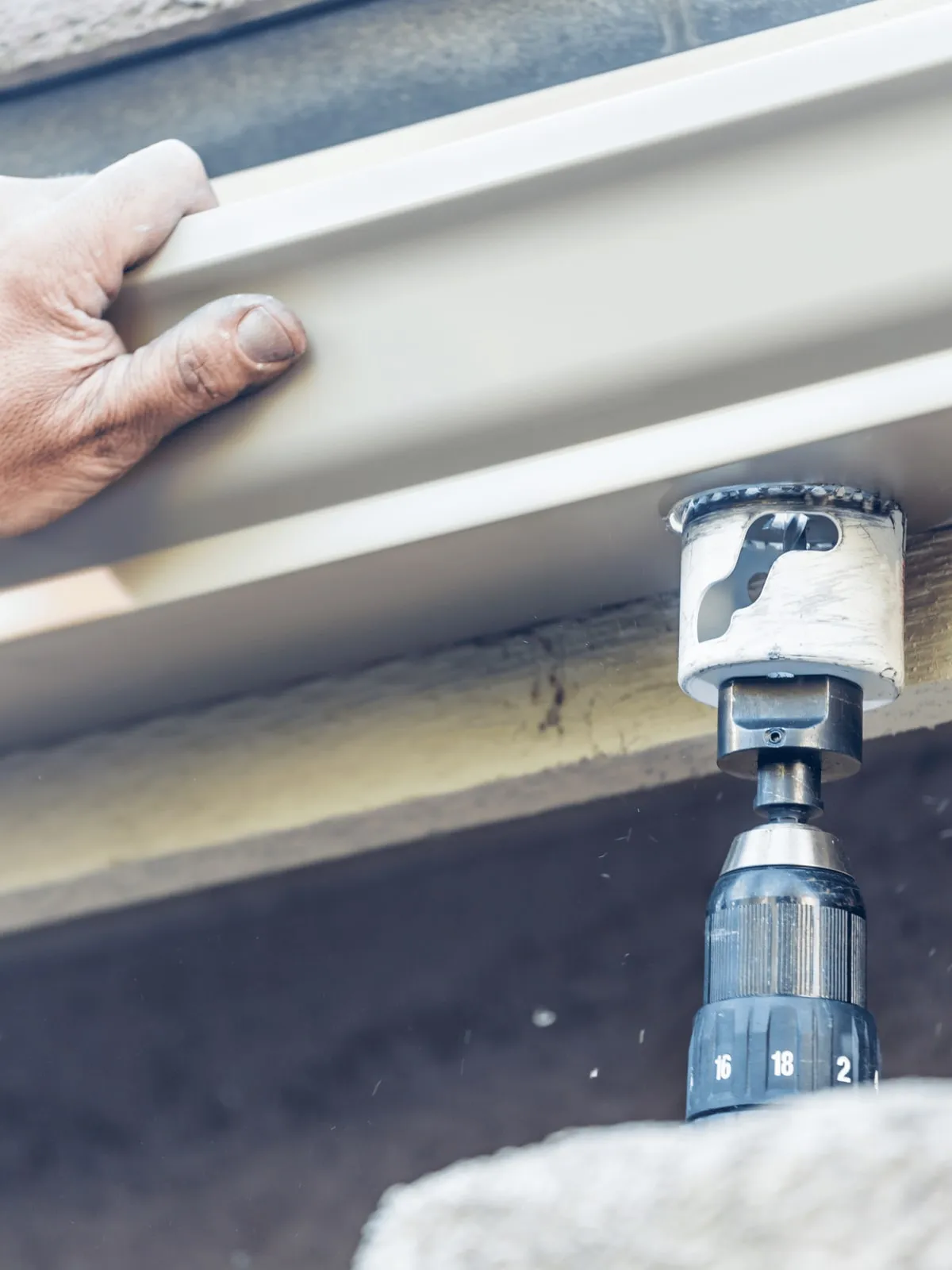 Cutting a downspout outlet into a new gutter