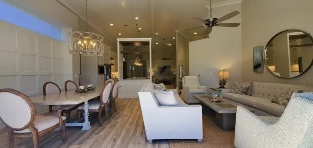 Renovated dining and living area with wood-look flooring