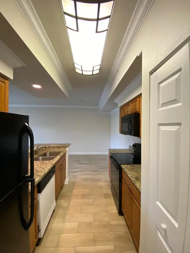 Condo kitchen and hallway after interior painting